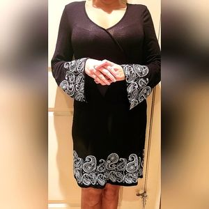 VENUS never-worn black dress with white lantern-style long sleeves and bottom.